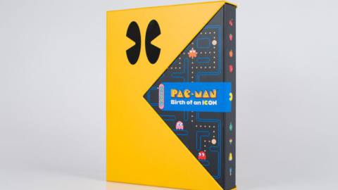 The Pac-Man: Birth of an Icon Special Edition stands upright with the book inside a Pac-Man slip case