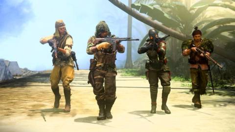 Four menacing looking special operations fighters with weapons raised, patrolling a sandy cliff.
