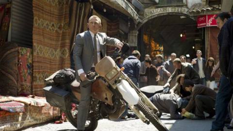 Daniel Craig as James Bond (007) on a motorbike in Skyfall