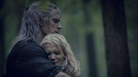 Ciri and Geralt hugging in a still from season 1 of The Witcher