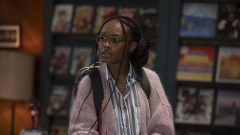 Naomi series star Kaci Walfall, in a comic-book shop