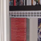 can the humidity of the bathroom damage my games??? and is it wrong to put the games in horizontal??? I like the way they look like this more lol, can it ruin my boxes??