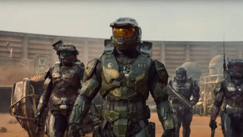 Master Chief and several Spartans walk through sand in the Halo TV show