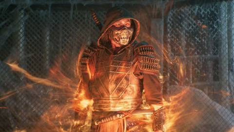 Mortal Kombat - an armored man wears a mysterious mask over his face. Flames swirl menacingly around him.