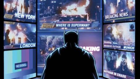 Batman stares at a computer monitor depicting multiple news feeds of blackouts and fires around the globe. Chyrons read “Where is Superman?” and “Gotham in Chaos?” on the cover of Batman: Fortress #1 (2022). 