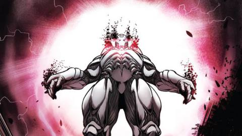 Tony Stark’s silver god-like form hovers menacingly in a pink sky in Iron Man #16 (2022).