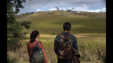 Joel and Ellie stare at a downed airplane in The Last of Us TV series