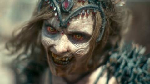 A zombie Vegas dancer growls in close-up in Army of the Dead