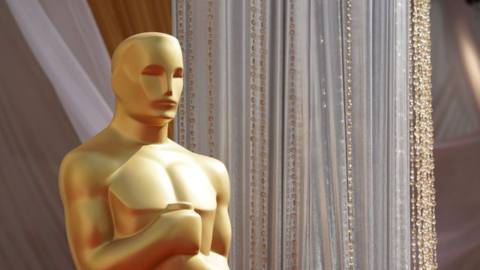 A human-sized Oscar statuette on the red carpet at the 94th Oscars