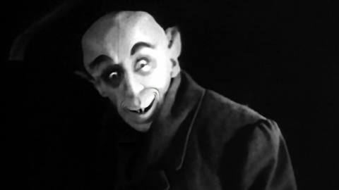 A still from “Graveyard Shift” with an altered Count Orlok grinning mischievously