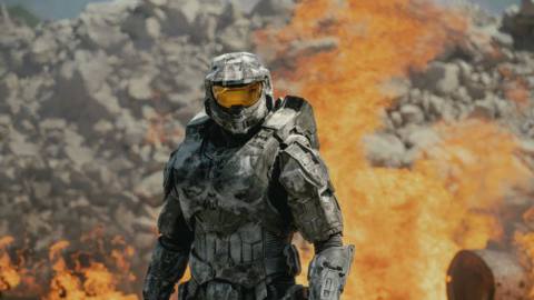 Master Chief standing in front of flames