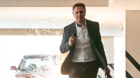 Liam Neeson walks away from an explosion, because he’s cool