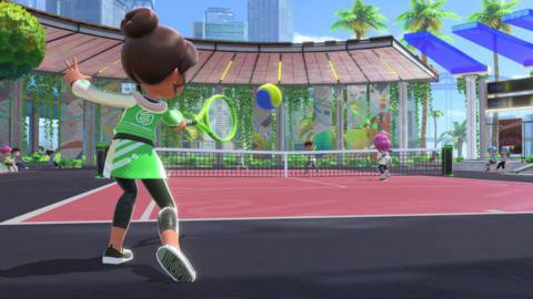 A “Sportsmate” swings her racket in a game of doubles tennis in Nintendo Switch Sports
