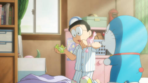 Doraemon and Nobita play with dinosaurs in Doraemon: Nobita’s New Dinosaur.
