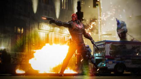 Red Hood aims a gun in a screenshot from Gotham Knights