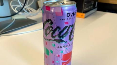 A close-up of a can of Coca-Cola Zero Sugar Byte sitting on a desk