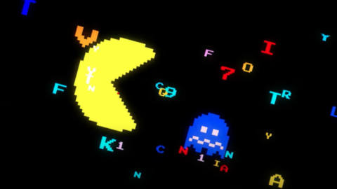 frame from the music video for “We Are Pac-Man!” — a giant Pac-Man is bearing down on a blued-out ghost as pixelated letters and numbers float behind them