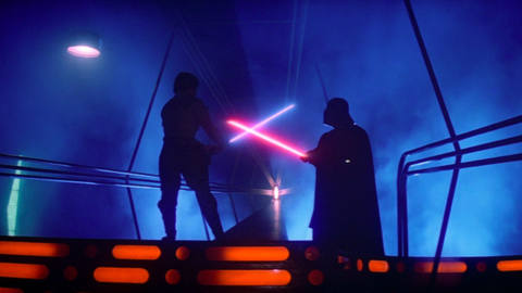 a duel between two silhouetted figures, Luke Skywalker and Darth Vader, in Star Wars Episode V: The Empire Strikes Back