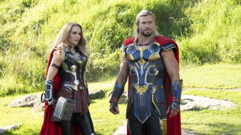 Thor and Jane Foster as The Mighty Thor stand in a field in Thor: Love and Thunder