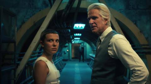 Matthew Modine and Millie Bobby Brown in a corridor in Stranger Things 4