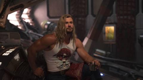 Thor (freaking jacked) sits relaxed aboard the Milano in a tank top in Thor: Love and Thunder
