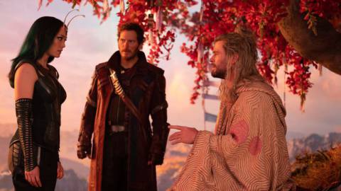 Thor in a robe atop a mountain, talks to Peter Quill and Mantis in Thor: Love and Thunder