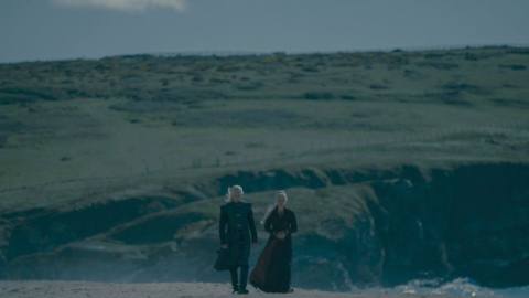 Viserys and Rhaenyra walking on a beach together