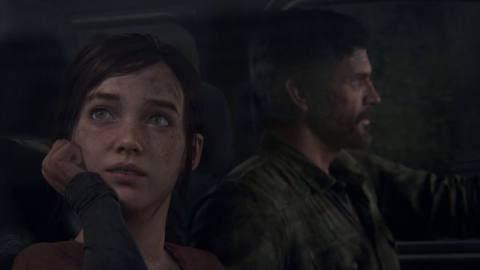 Ellie looking up as Joel in the background drives a car in The Last of Us Part 1 on PS5