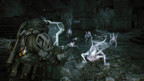 A Colonial Marine holds up a shield and aims at Pathogen-mutated Xenomorphs in a screenshot from Aliens: Fireteam Elite