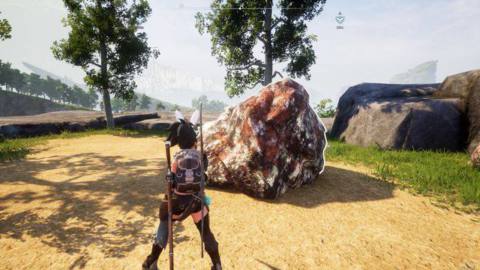 A Palworld player stands in front of a large ore deposit.