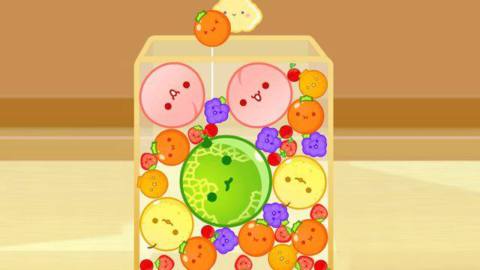 A box full of cute fruit with faces filling in the games in Suika Game, with a honeydew melon in the center with peaches and asian pears surrounding it.