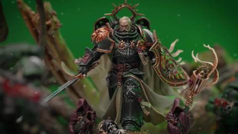 Lion El’Johnson strides out to battle against a green backdrop. It is snowing lightly. In his hand the sword Fealty, and on his arm a shield said to have belonged to the Emperor himself.