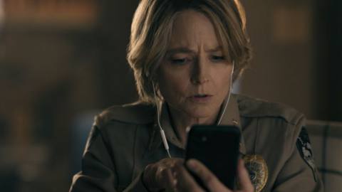 Jodie Foster as Chief Liz Danvers looking at a phone in True Detective: Night Country.