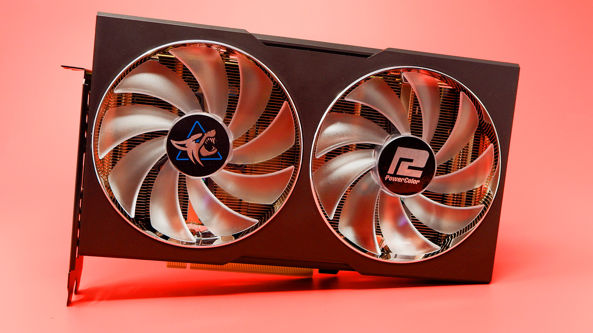 PowerColor Hellhound RX 7600 XT graphics card on a red background,