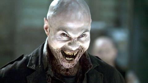 A blood drenched vampire leers with fanged teeth in 30 Days of Night