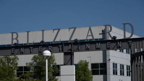 A photograph of the entrance to Blizzard Entertainment in California. On an archway, letters spell out Blizzard