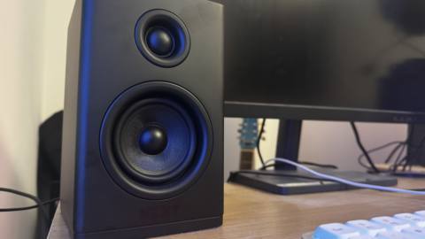 The right speaker of the NZXT Relay set on a wooden desk