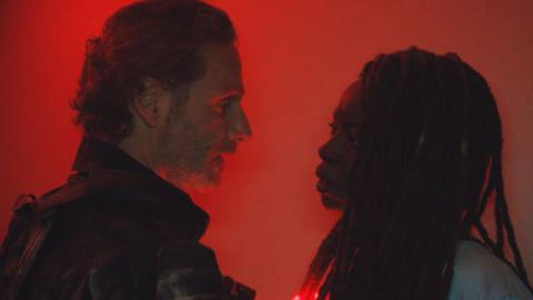 Rick (Andrew Lincoln) and Michonne (Danai Gurira) standing and looking at each other in a still from The Ones Who Live