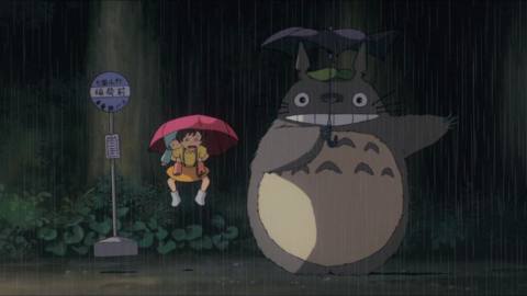 satsuki and mei jump in the air when totoro makes the rain come crashing down