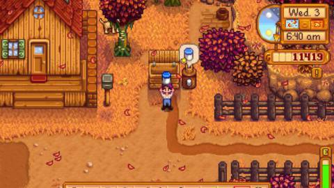 A Stardew Valley avatar holding a jar of mayo above her ahead during the fall season.