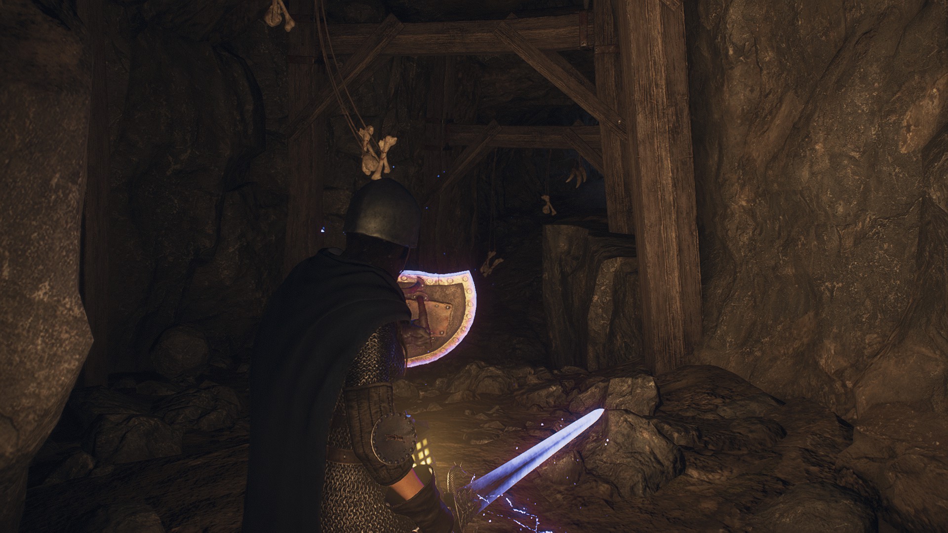 A warrior walking through a dark tunnel in Dragon's Dogma 2.