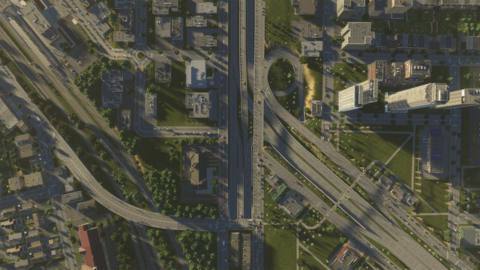 A bird’s eye view image of interlocking highways and streets in Cities: Skylines 2