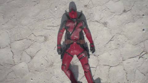 Deadpool faints on the desert ground next to a Secret Wars comic book in Deadpool &amp; Wolverine