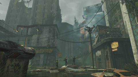 Three people walking through a derelict city