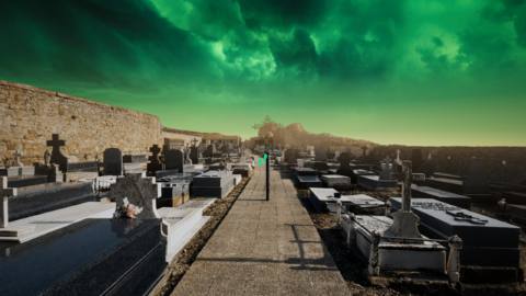 a graveyard under a green sky