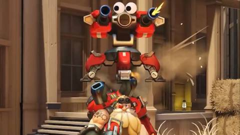 Torbjorn runs through the Hollywood map with his turret mounted on his head in a screenshot from Overwatch 2