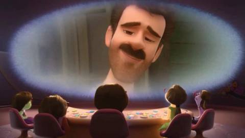 The dad from Inside Out, a white man with dark hair and a mustache, smiles at the camera. A group of emotions look up at him. He’s framed by dreamy silver lighting.