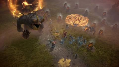 Diablo 4 characters battle a giant troll on a grassy battlefield.