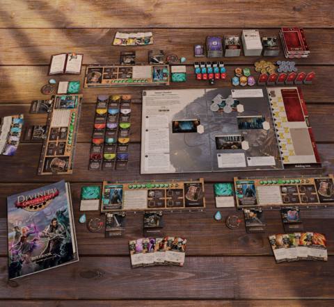 The Divine Atlas and other components of the Divinity: Original Sin board game.