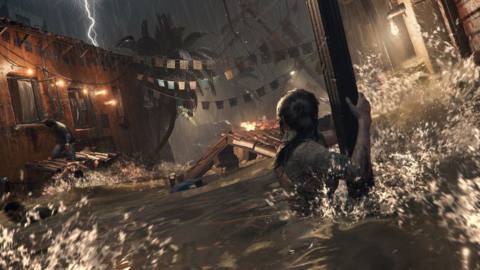 Shadow of the Tomb Raider screenshot, showing Lara Croft in front of a scene of destruction, holding onto a pillar